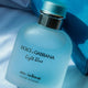 A bottle of Dolce & Gabbana Light Blue Eau Intense Pour Homme cologne, with its box visible in the background.