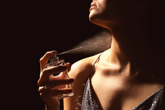 Woman applying a 1 oz perfume spray, highlighting its compact and travel-friendly size