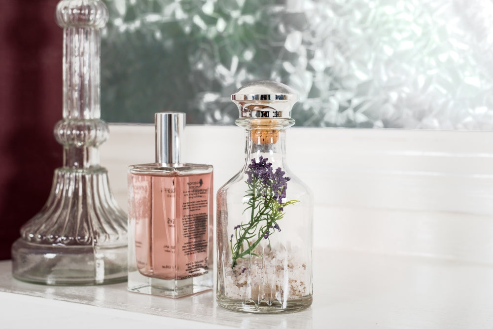 Vanity with bottles evoking YSL Libre Intense and Phlur Golden Rule