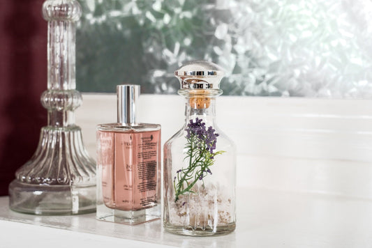 Vanity with bottles evoking YSL Libre Intense and Phlur Golden Rule
