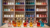 Perfume bottles displayed on shelves in a fragrance store